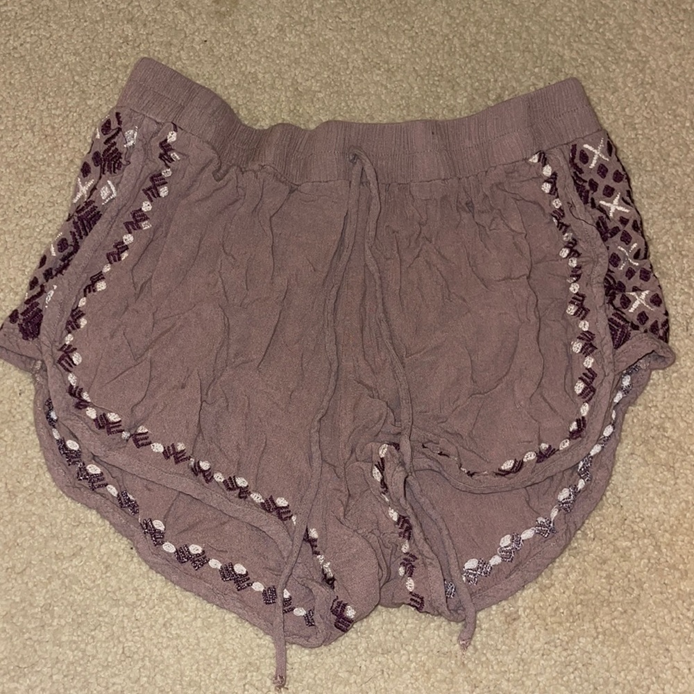 Size M purple patterned booty shorts